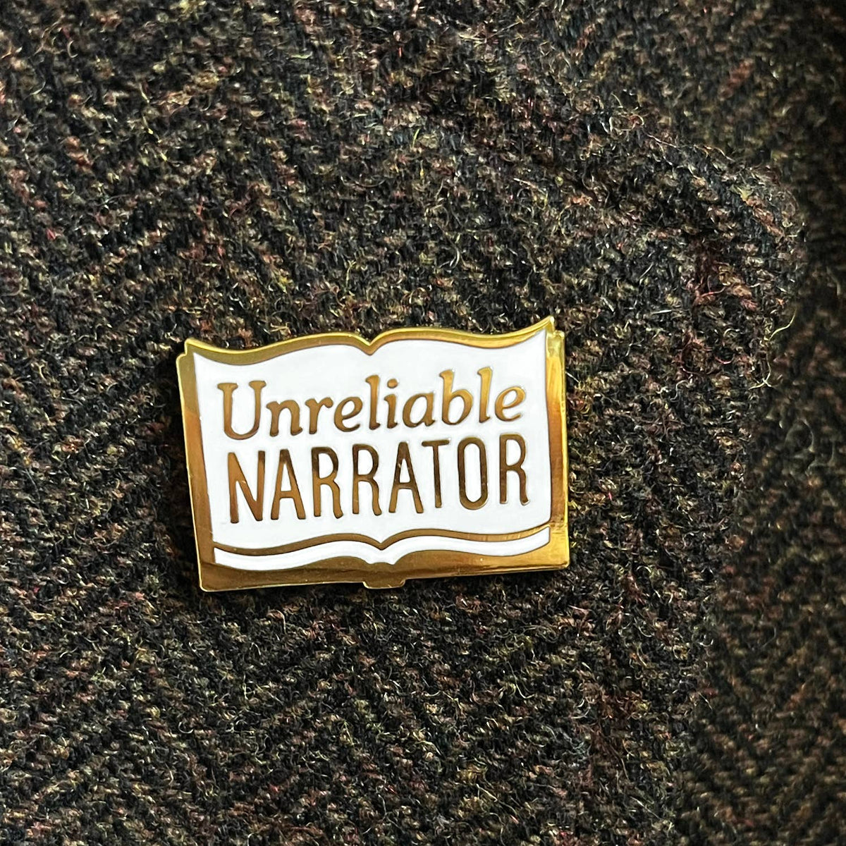 Unreliable Narrator enamel pin